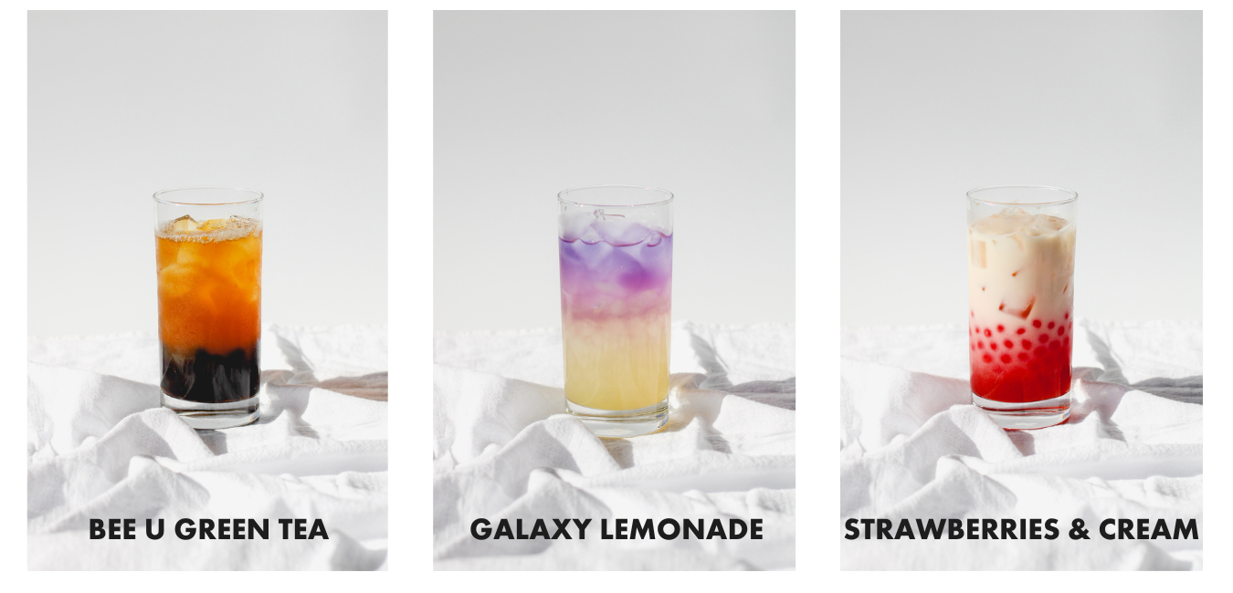 Three drink line-up including Bee-U Green Tea with Tapioca Boba, Galaxy Lemonade, and a Strawberries & Cream with Strawberry Popping Boba. The drinks are on a white linen cloth with a white background.